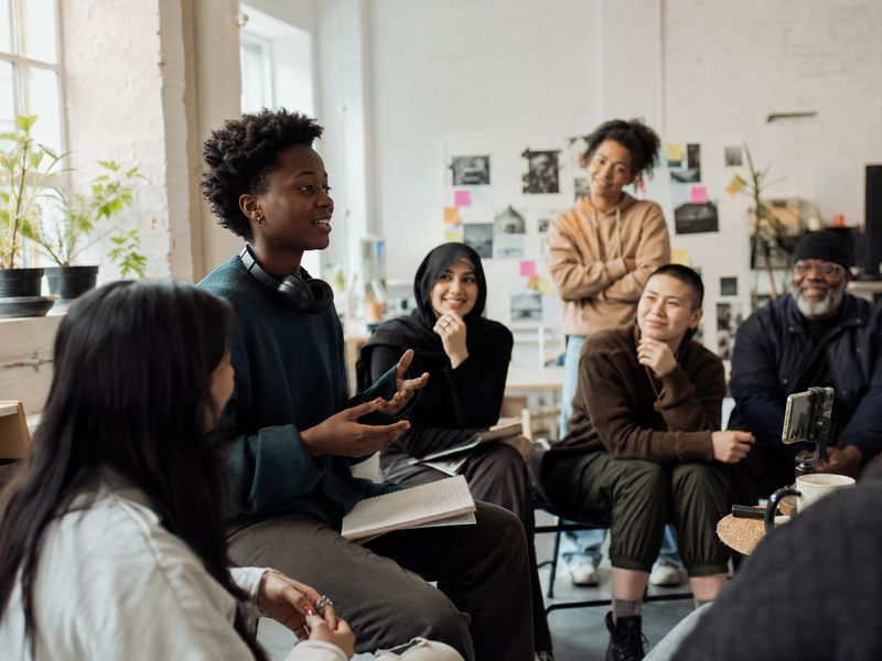 Young people in a lively group discussion